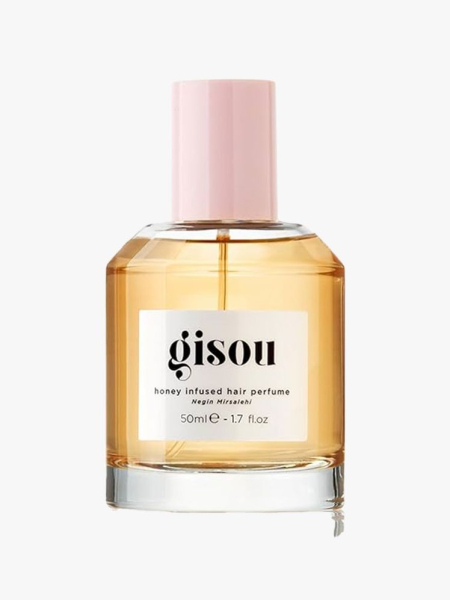 A bottle of Gisou Honey Infused Hair Perfume on a light gray background