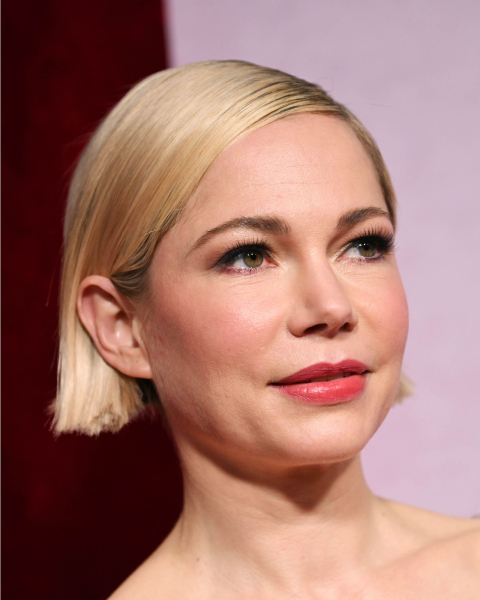 Michelle Williams with a slicked back sidepart blonde sharp bob.
