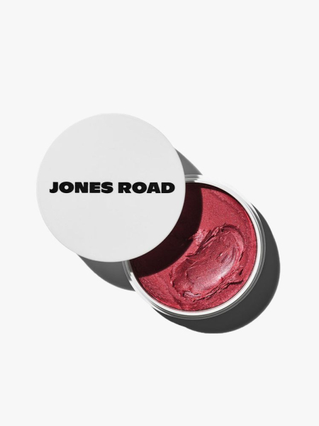 Jones Road Miracle Balm in pink with white lid on light grey background
