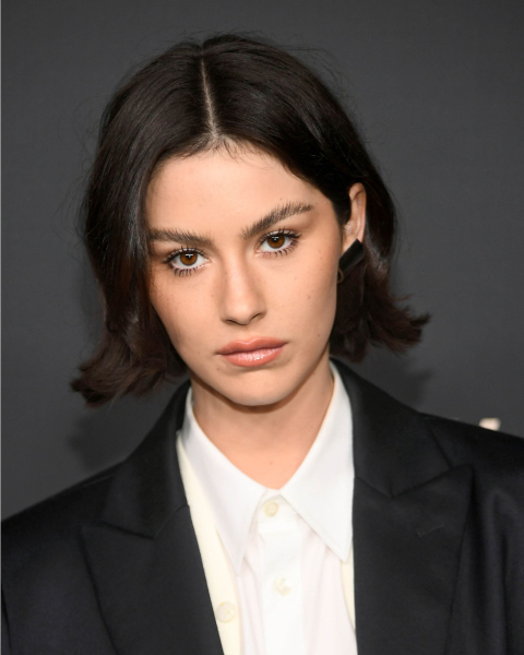 Gracie Abrams with a sleek bell bob and one side tucked behind an ear.