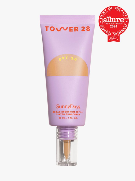 tinted sunscreen in branded soft purple tube with applicator on light gray background with red and white 2024 allure best of beauty seal