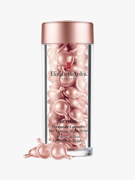 Elizabeth Arden Retinol Ceramide Capsules Line Erasing Night Serum clear bottle with pink beads and pink top on light grey background
